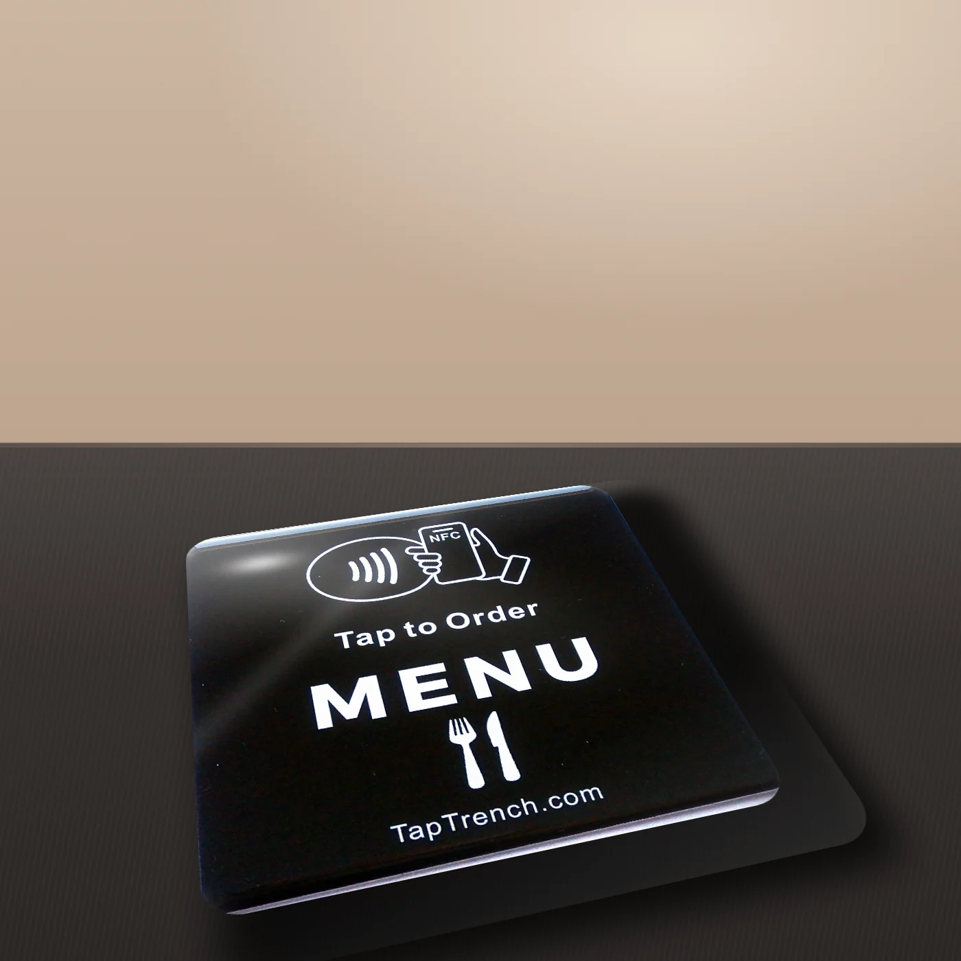 Tap Trench menu plate on a counter